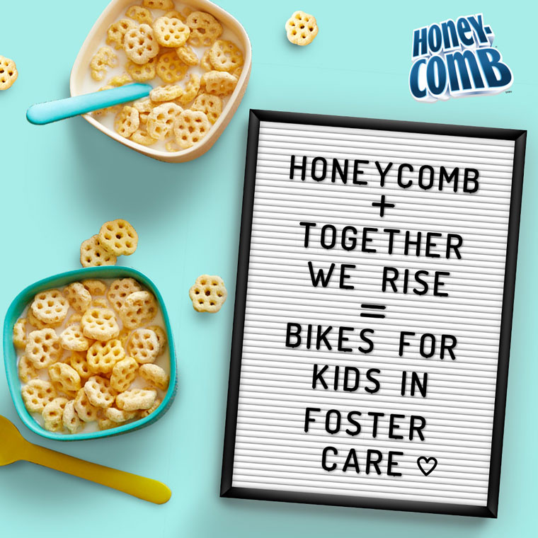 Letterboard that says honeycomb plus together we rise equals bikes for kids in foster care