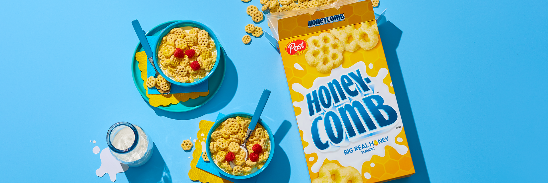 Honeycomb cereal box and bowls with milk