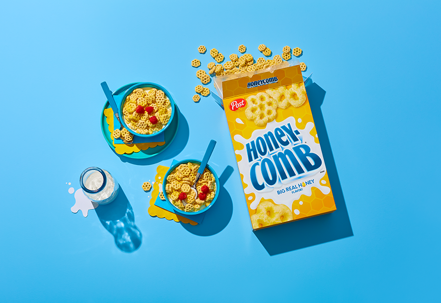 Honeycomb cereal box and bowls with milk
